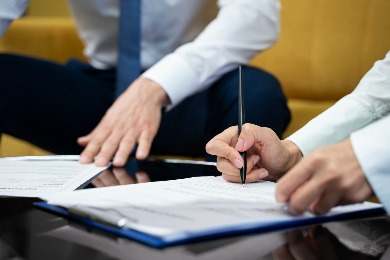 People signing documents