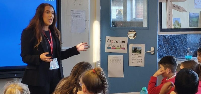 Deanna Crosby delivering a careers chat in a class room to a school in Sheffield.