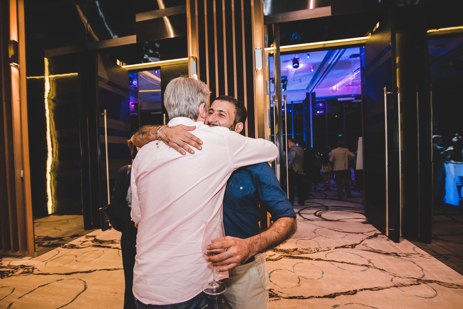 Two men hugging
