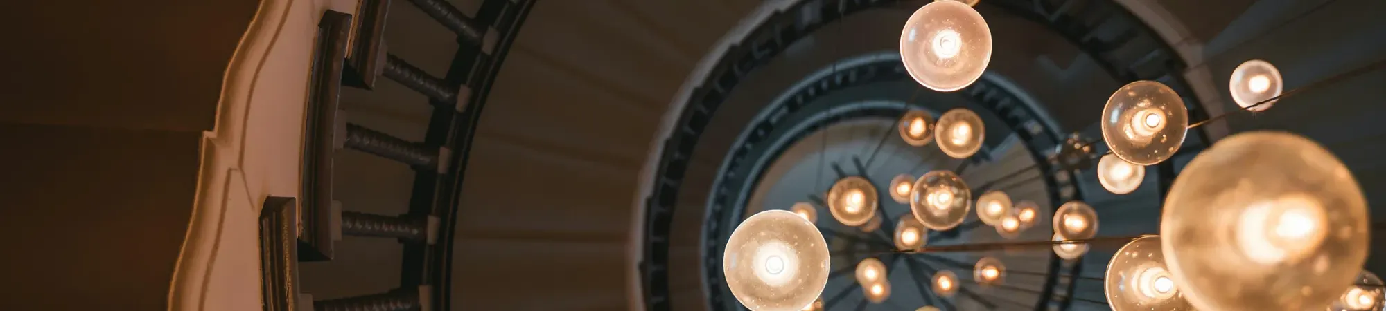 Spiral stair case with round light bulbs