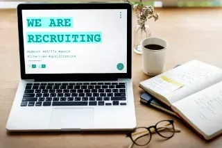 A laptop showing a recruitment interface for job sharing opportunities.