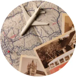 Toy plane on map with photographs