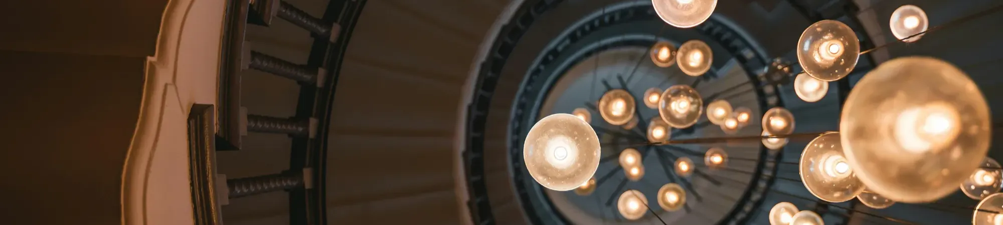 Spiral stair case with round light bulbs