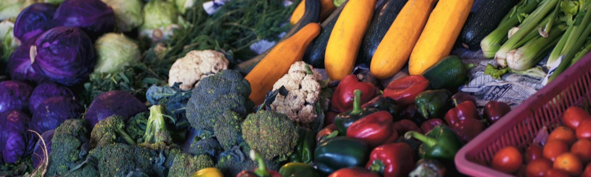 An enticing display of locally grown vegetables, sourced from a nearby farm shop, adorning a table with their vibrant colors and freshness.