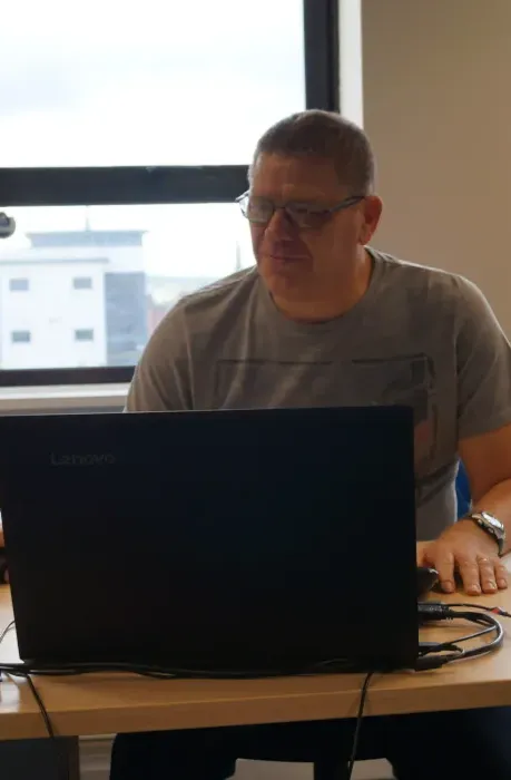 Picture of Opps Director Glenn Spenceley at his desk working