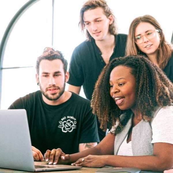 Group Looking At A Laptop