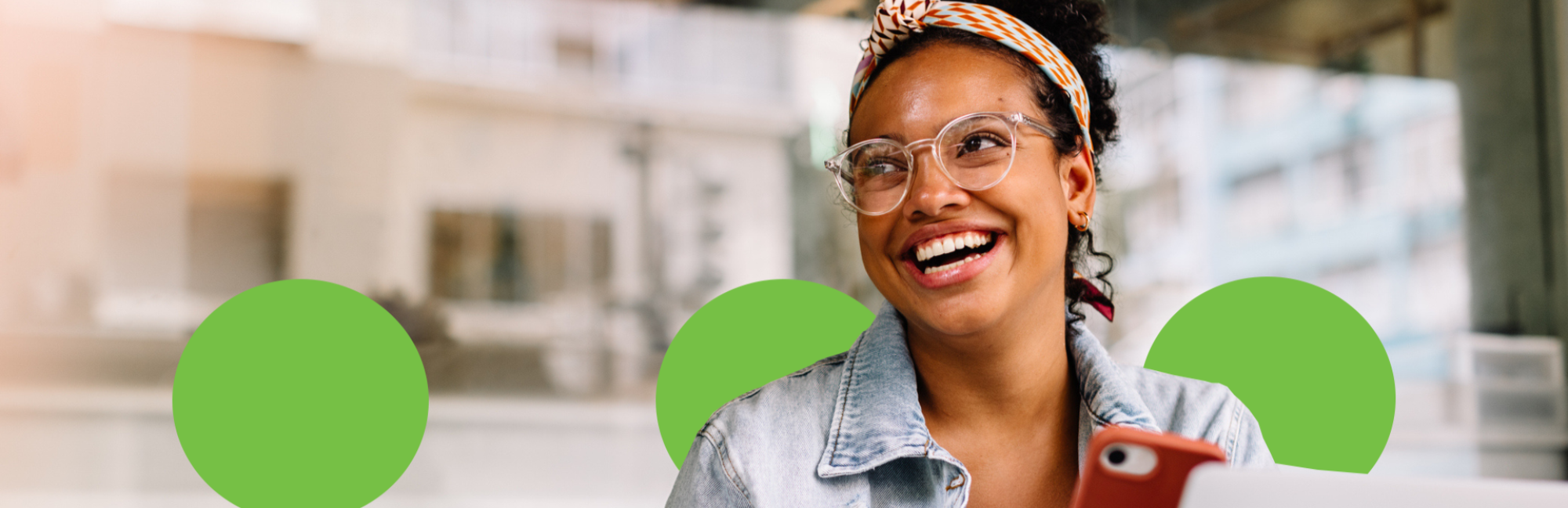 Woman smiling and laughing looking away from the camera