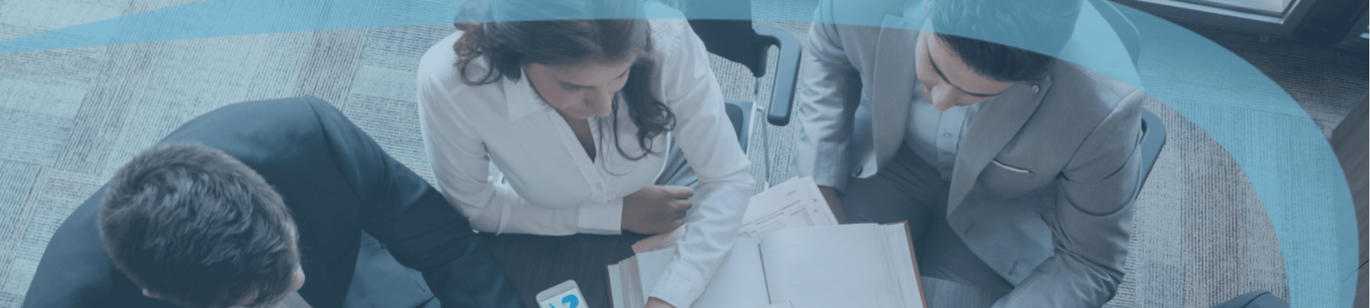 Candour Talent Recruitment Agency - Clients Page - Header Photo of office environment with people working together in a team, collaborating closely around a table, reflecting our commitment to teamwork and collaboration in serving our clients.