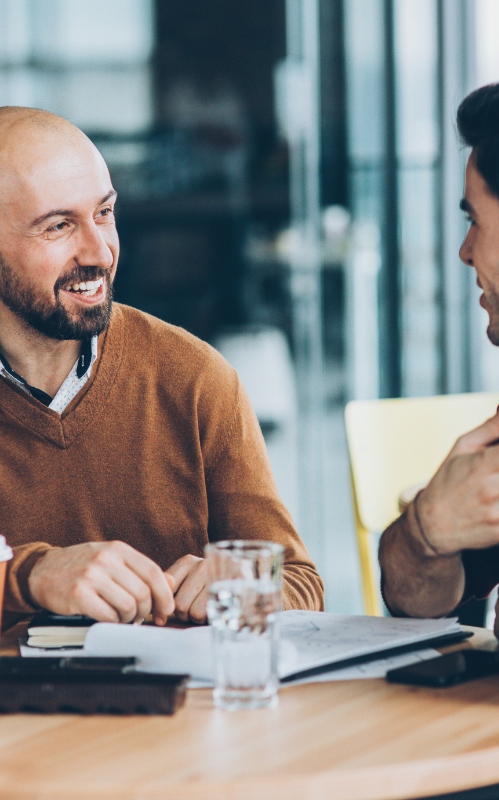 two working professionals mid conversation 