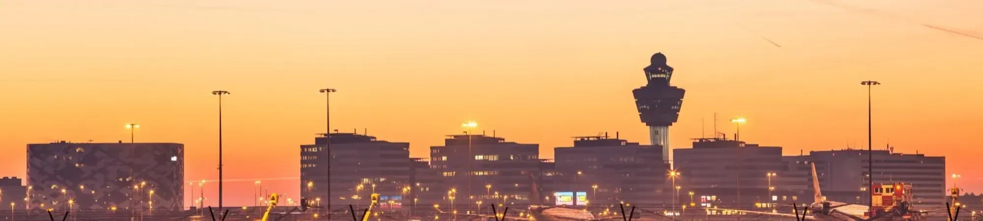 Schiphol Airport by night with airplanes. Aviation